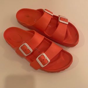 Orange rubber birkenstocks